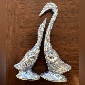 Handmade metal kissing swans